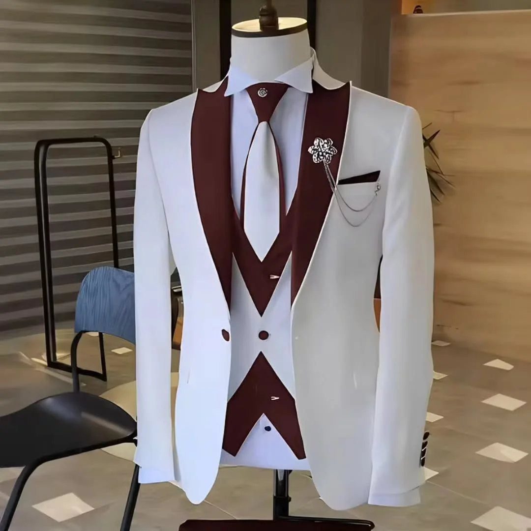 A white suit with maroon lapels and waistcoat displayed on a mannequin.
