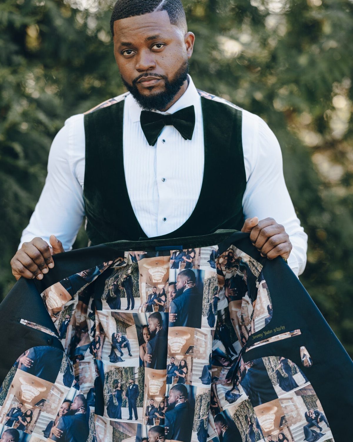 Man holding open a black suit jacket to reveal a custom photo collage lining.