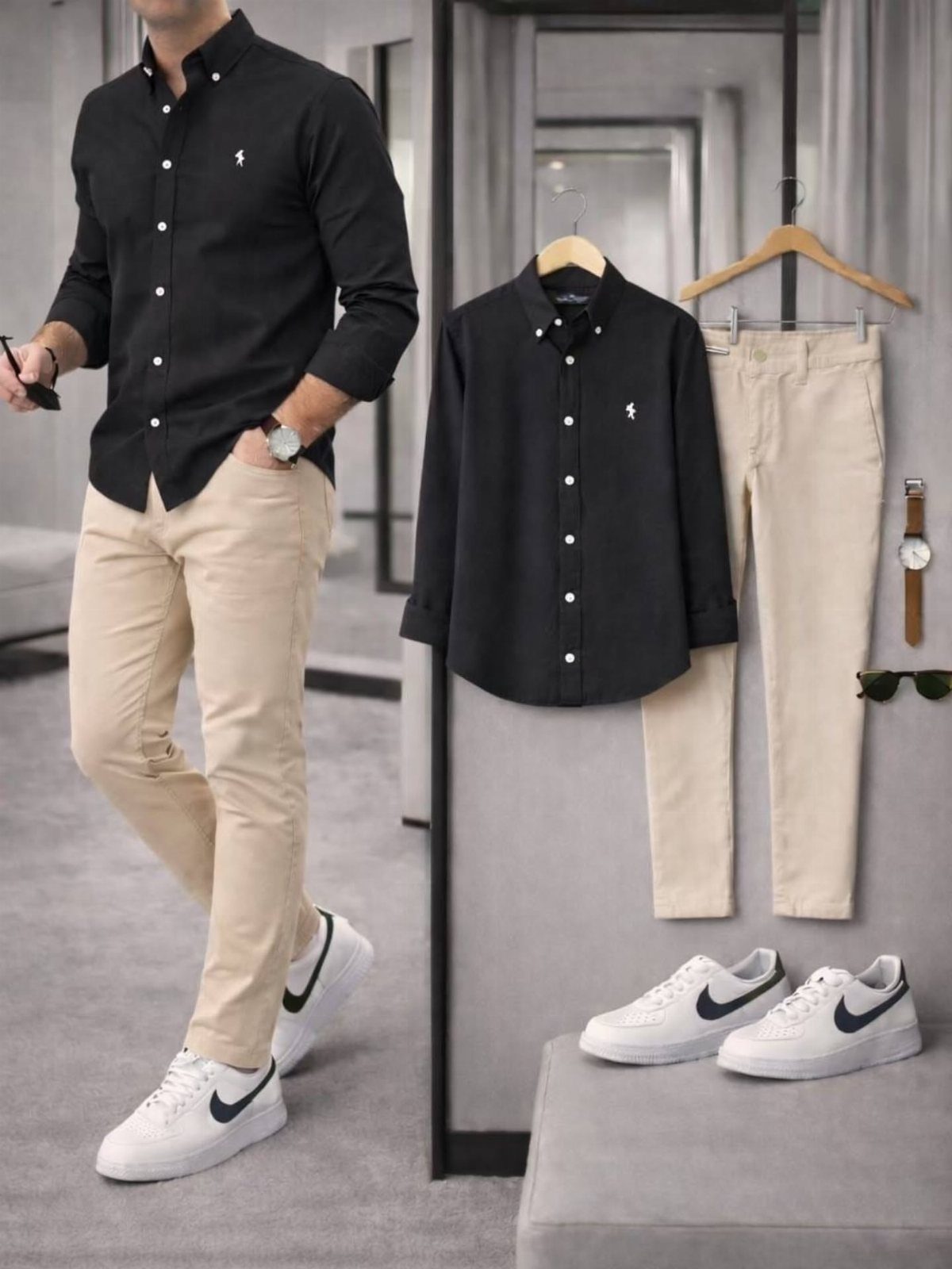 Man in black shirt and beige trousers standing next to a clothing display.