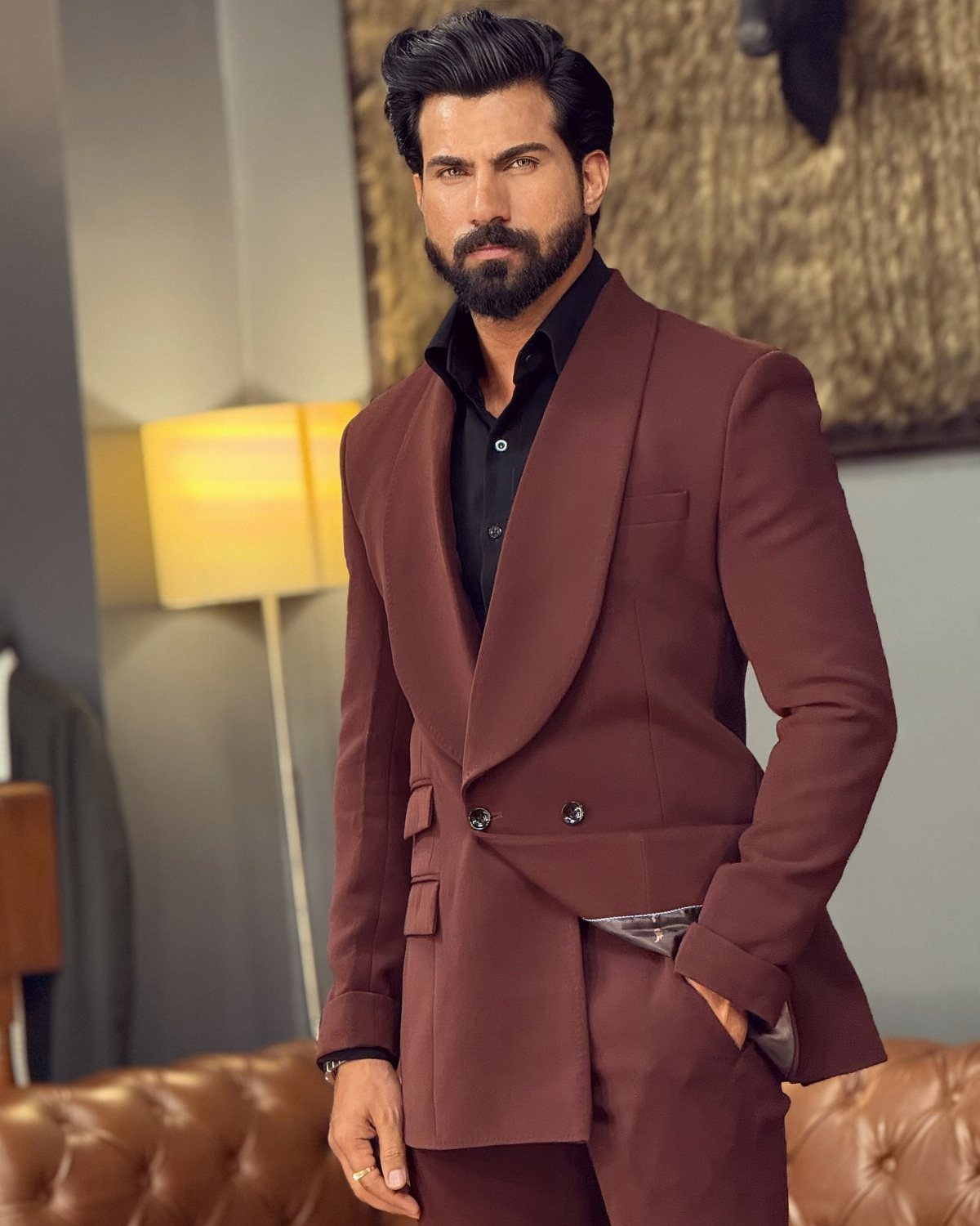 Man wearing a maroon double-breasted suit featuring a smooth shawl lapel and black shirt.