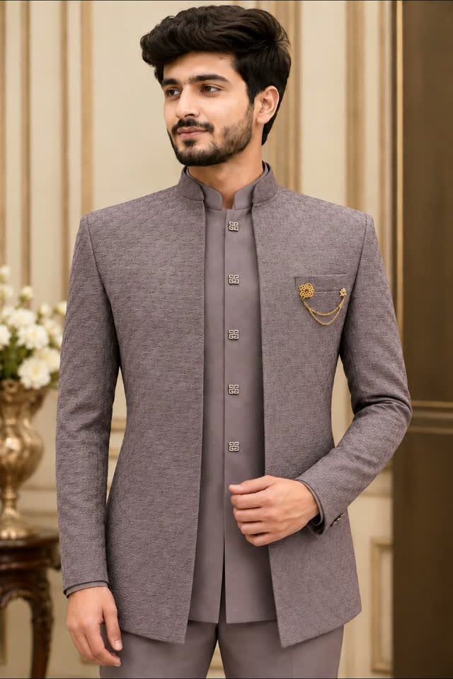 Man wearing a textured mauve Nehru jacket and matching waistcoat set.